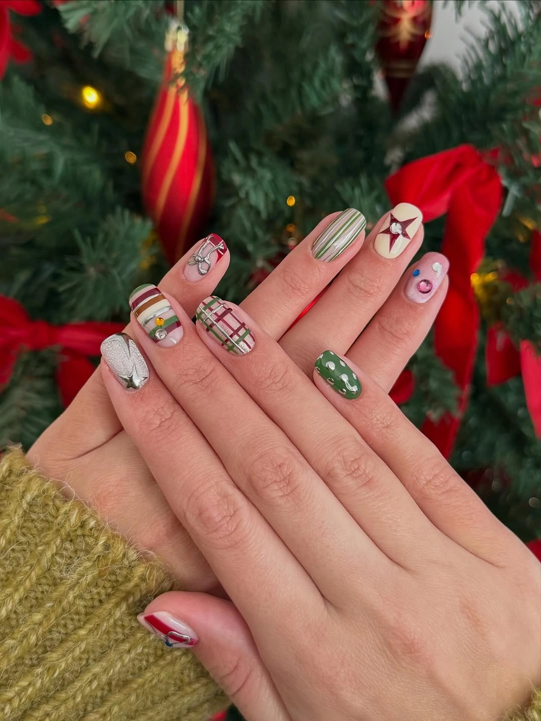 Square Christmas nails with green plaid, colorful stripes, bows and silver accents