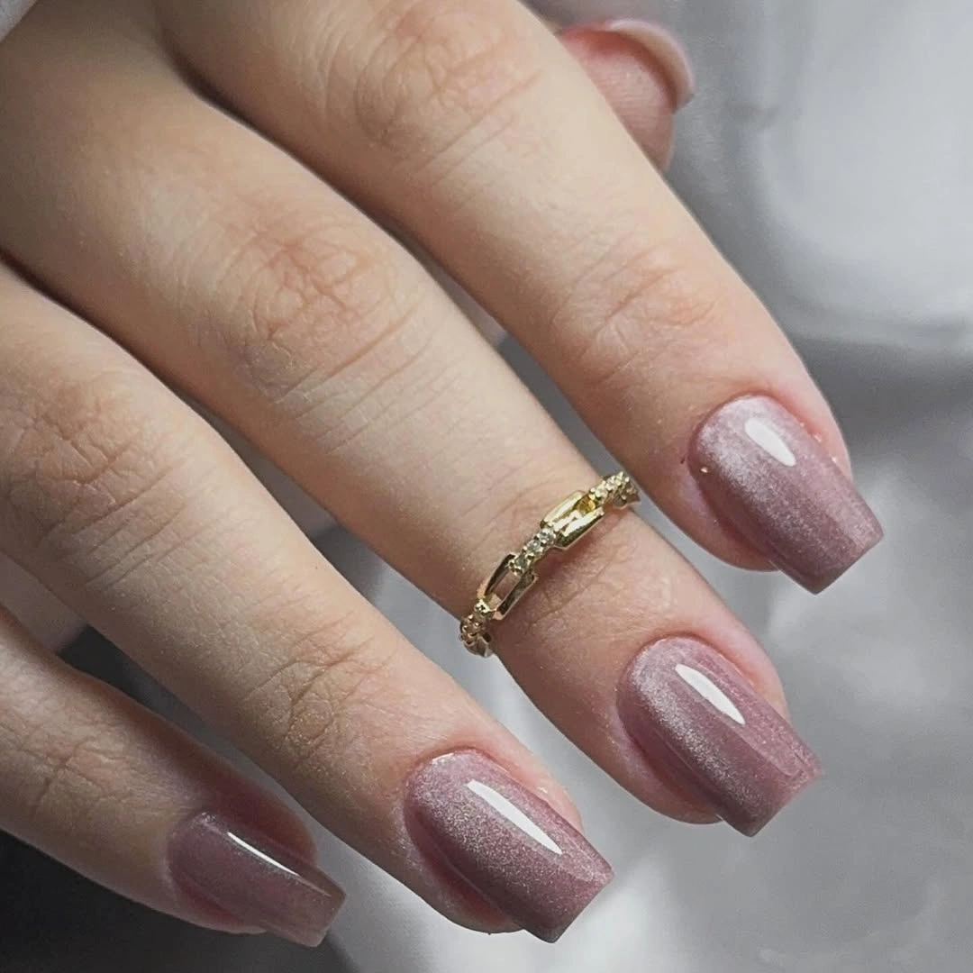 Long square nails with uniform muted blush nude shimmer